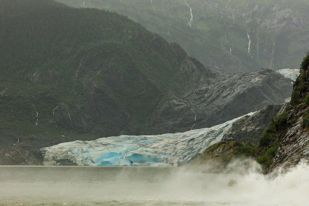 Cruise ship sailing past a glacier in Alaska's Inside Passage — 1