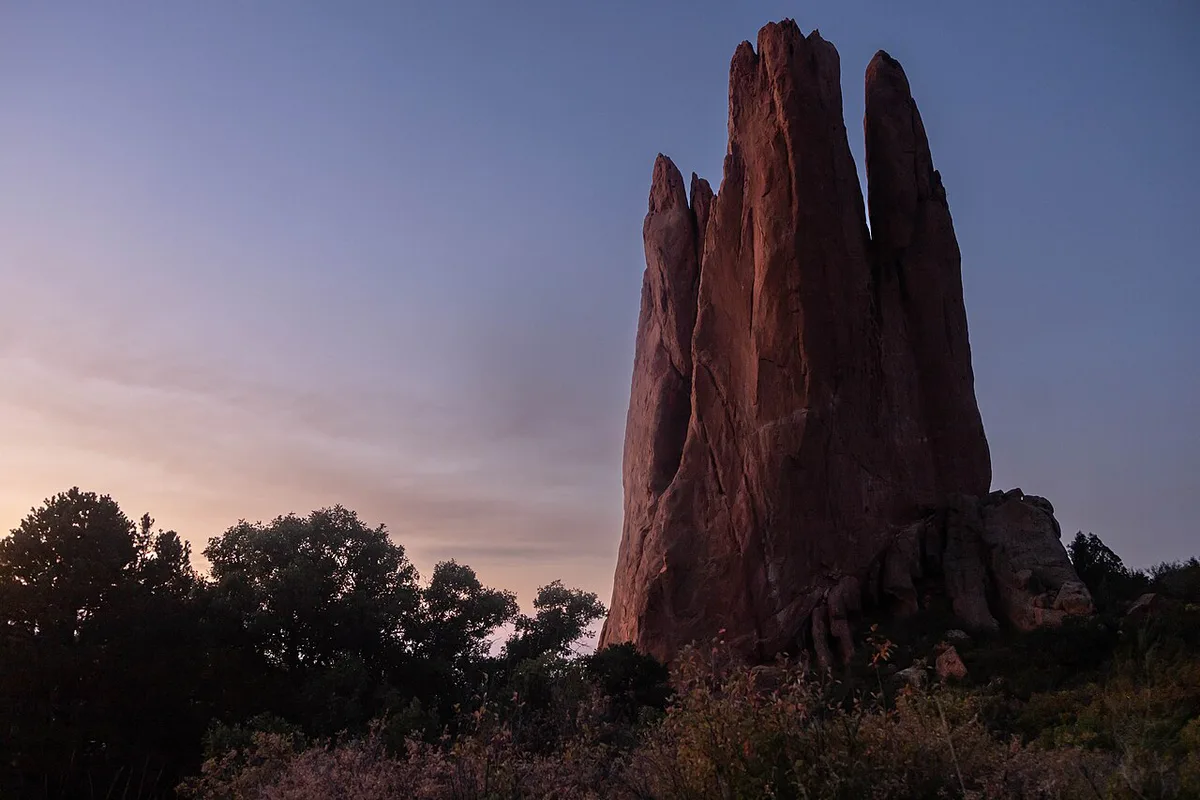 Red rock formations of Garden of the Gods with Pikes Peak behind — 1