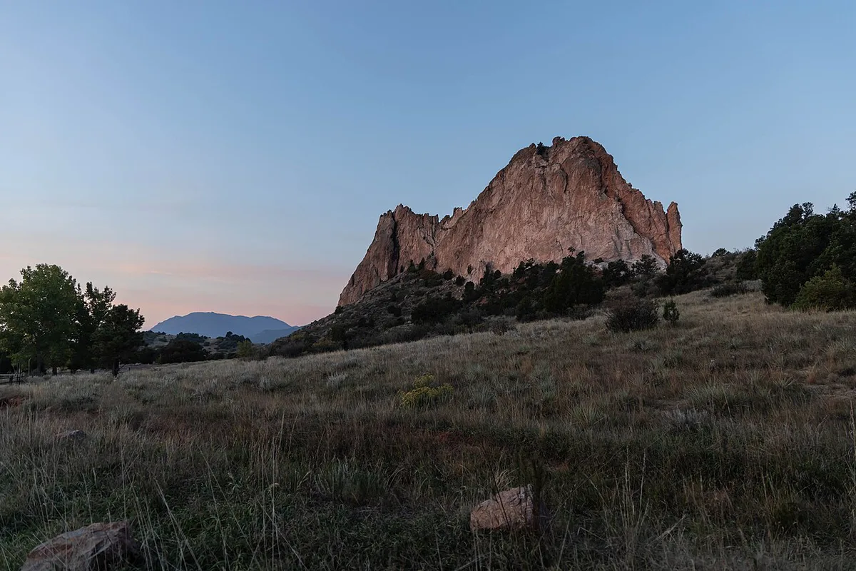 Red rock formations of Garden of the Gods with Pikes Peak behind — 2