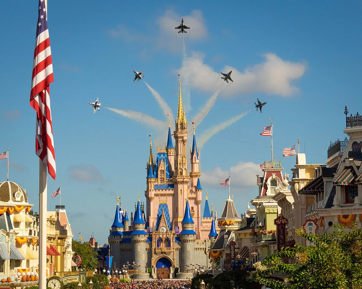 Cinderella Castle at Magic Kingdom with families and strollers on Main Street — 2