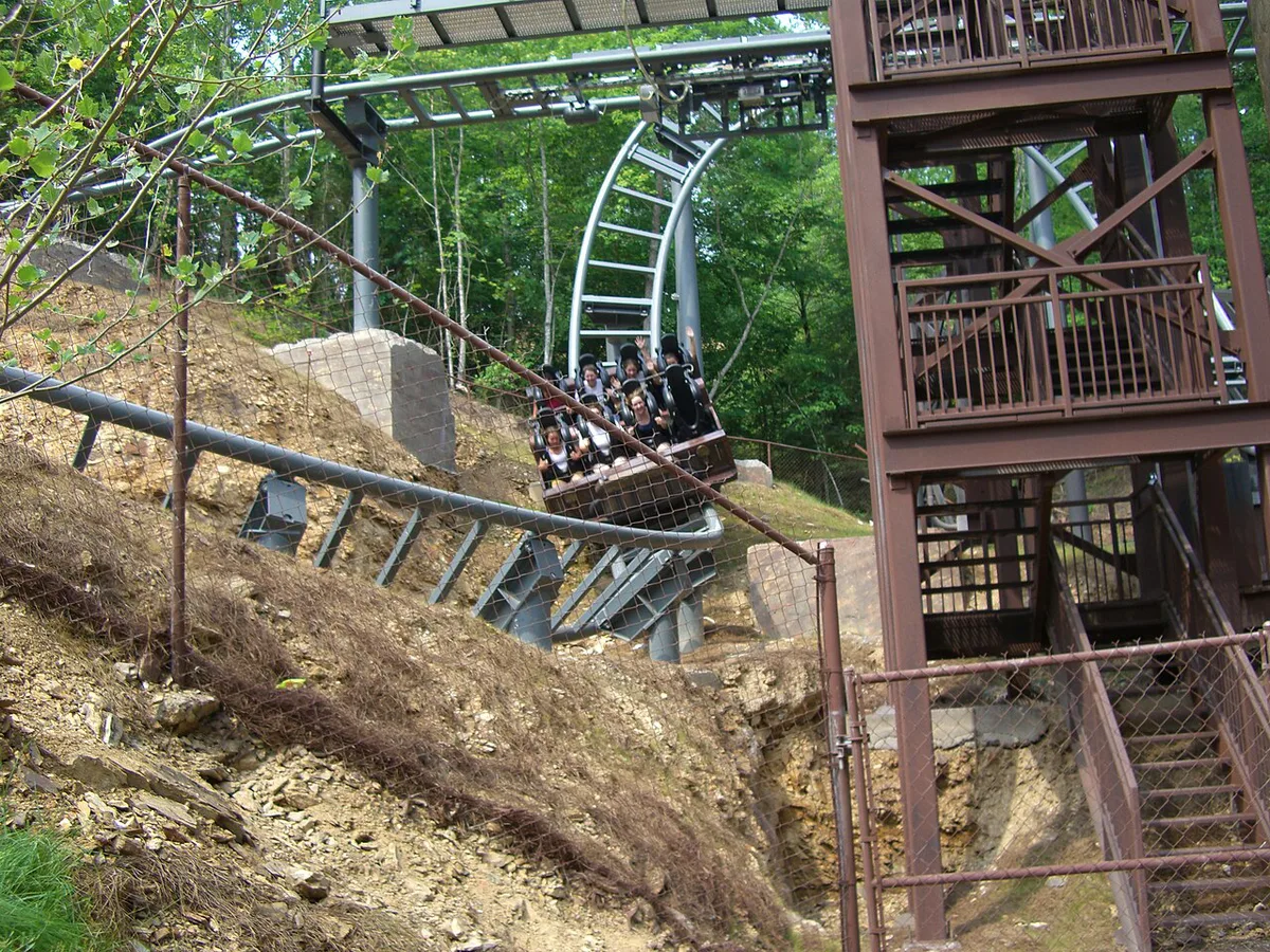 Wooden roller coaster winding through the trees at Dollywood — 1