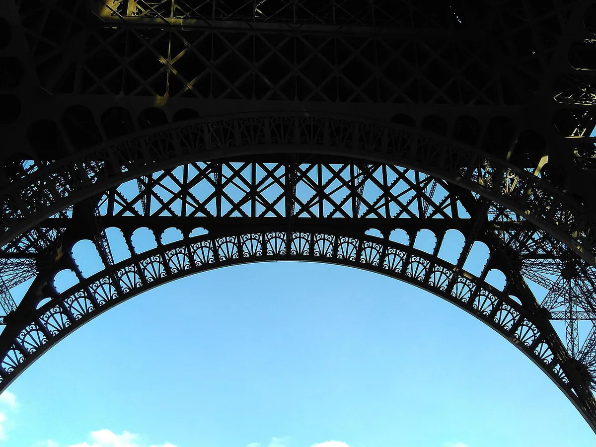 Looking up at the Eiffel Tower from directly below the arches — 2