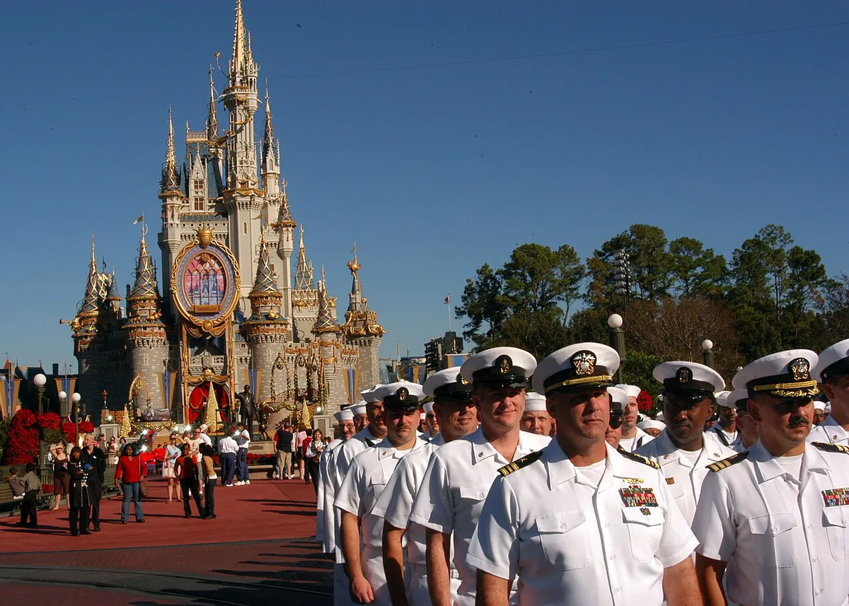 Family walking up Main Street USA toward Cinderella Castle in the morning — 1