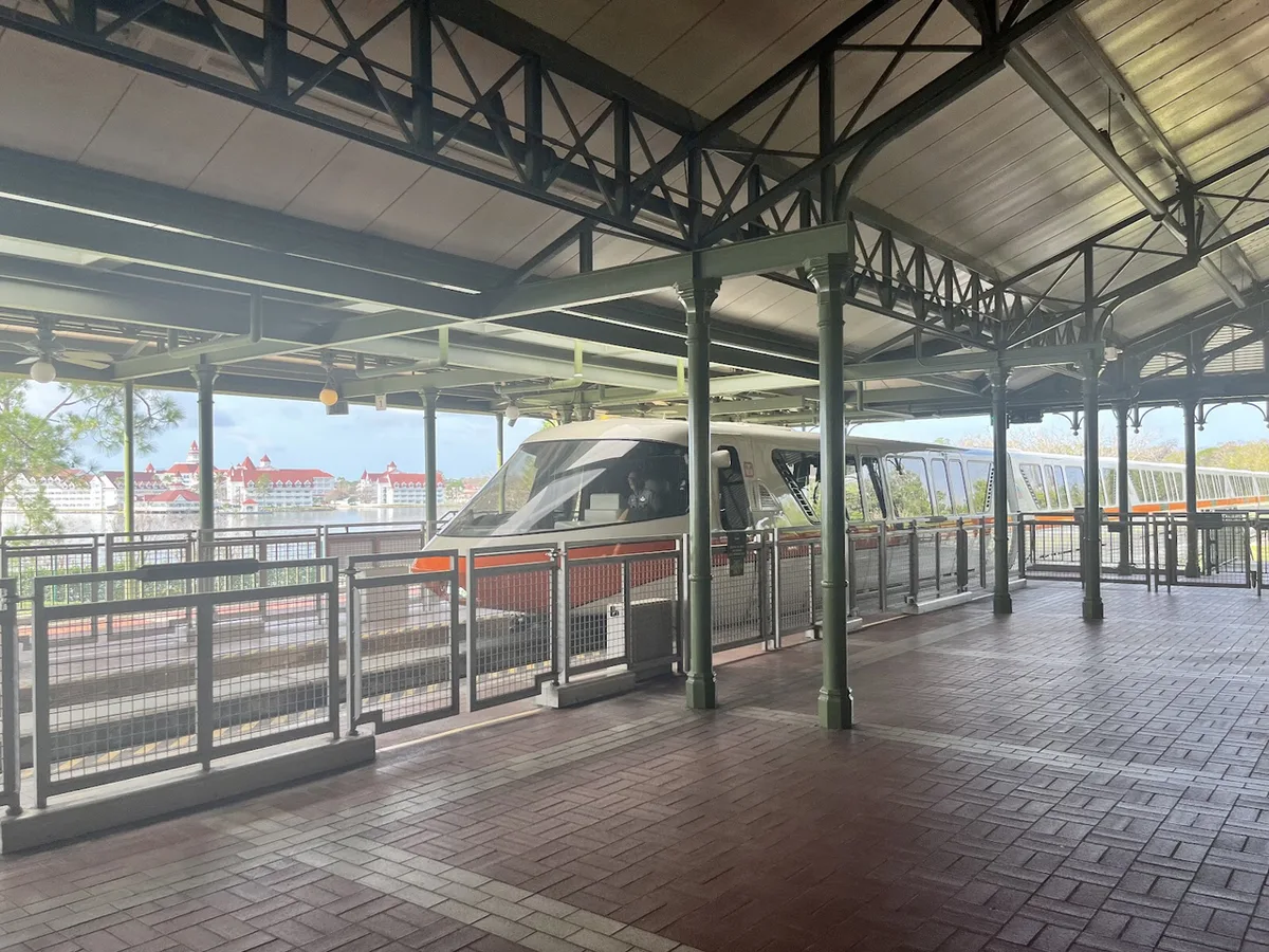 Monorail orange pulling into station — 2