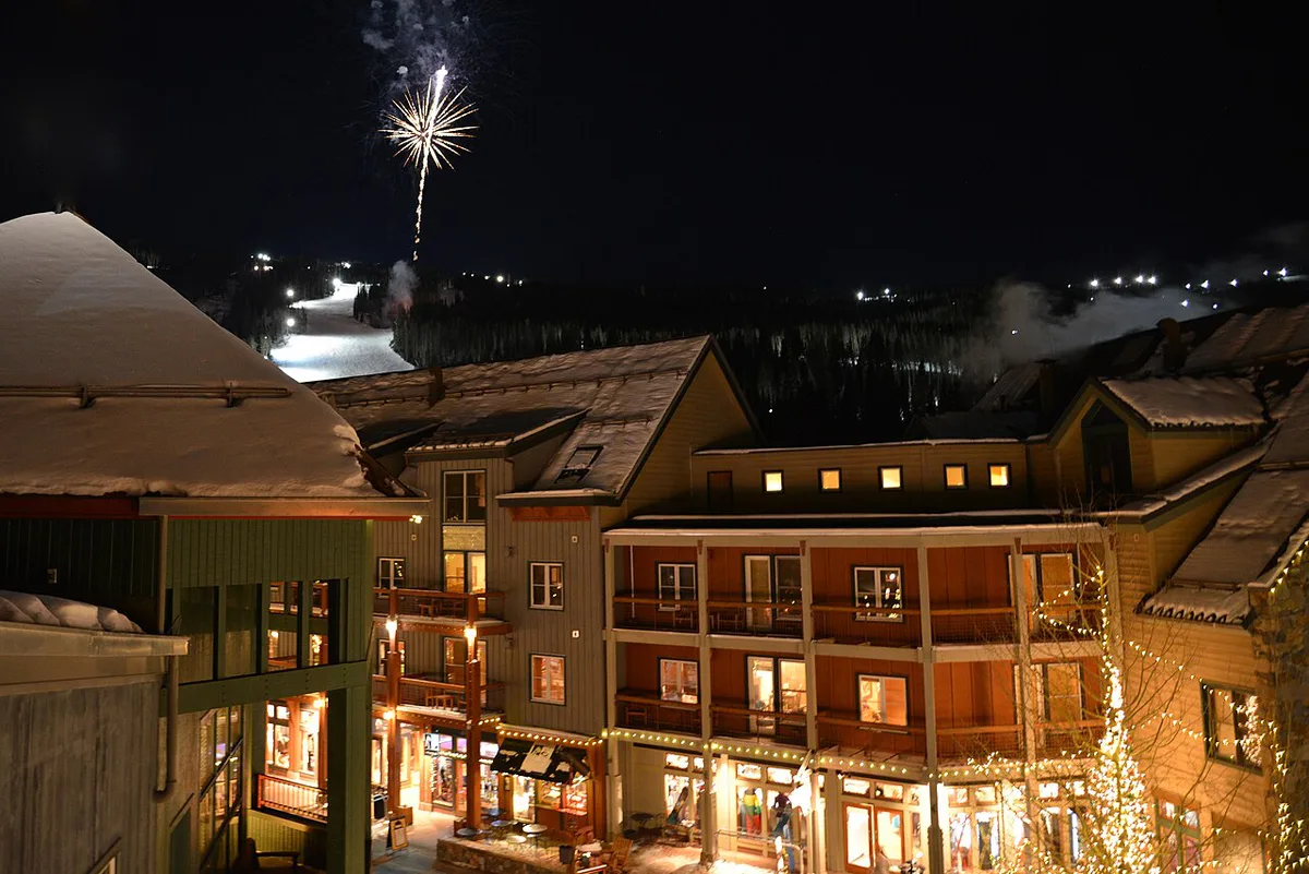 Skiers on a groomed run above River Run Village at Keystone Resort — 1
