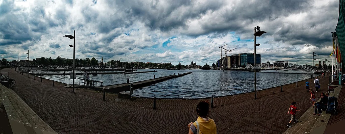 Green ship-shaped NEMO Science Museum building rising over the Oosterdok in Amsterdam — 2