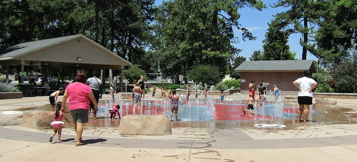 Children playing in a splash zone at an indoor water park — 2