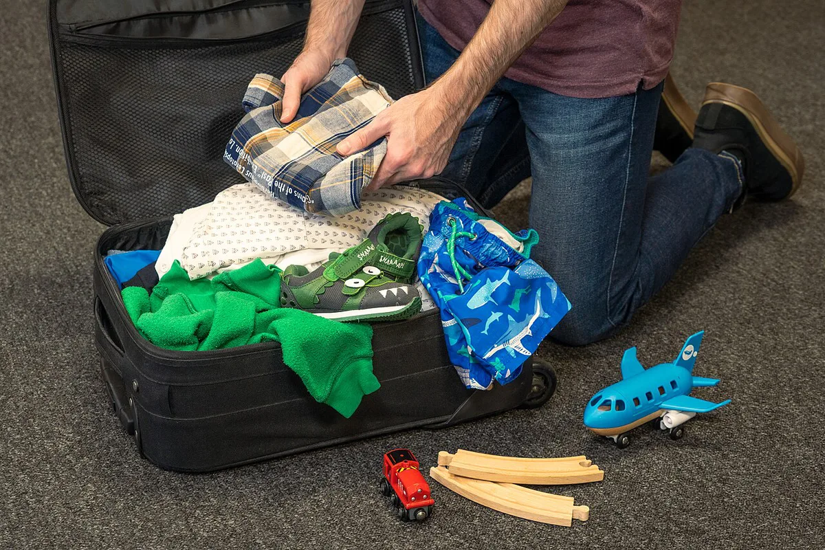 Open suitcase neatly organized with color-coded packing cubes — 2