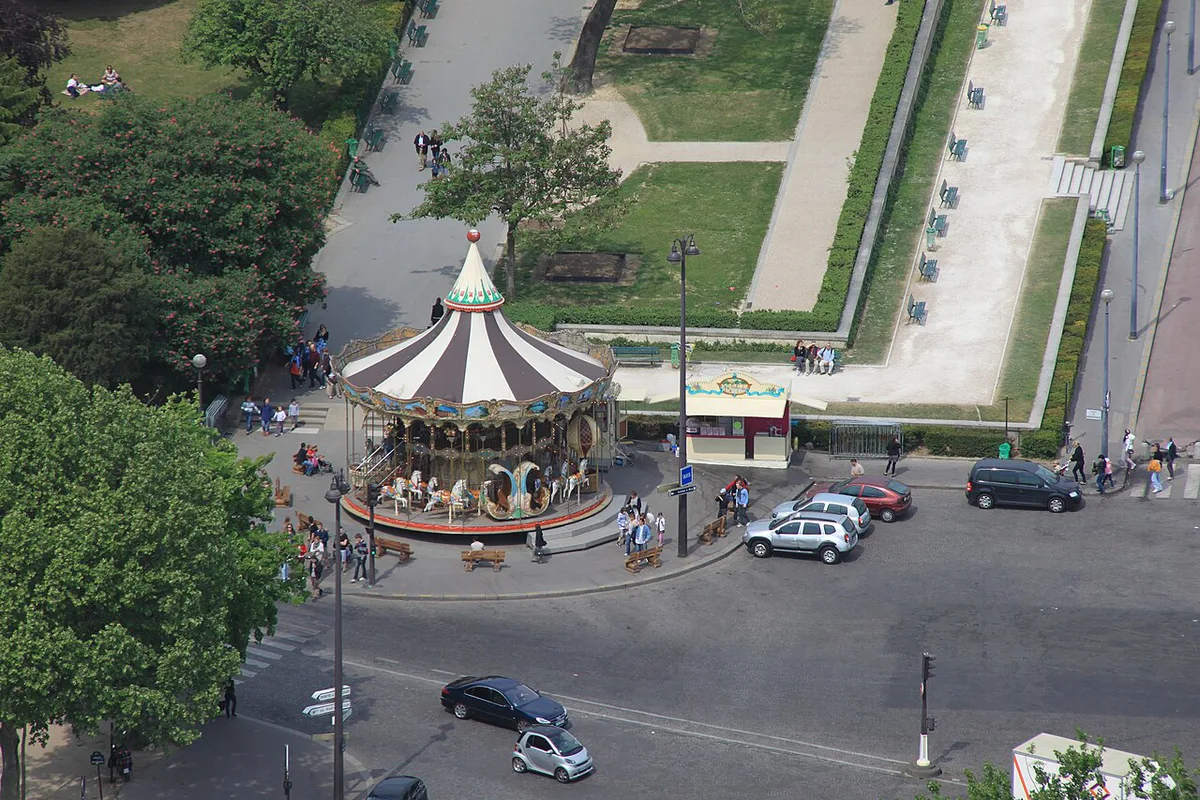 Classic Parisian carousel with the Eiffel Tower in the background — 2