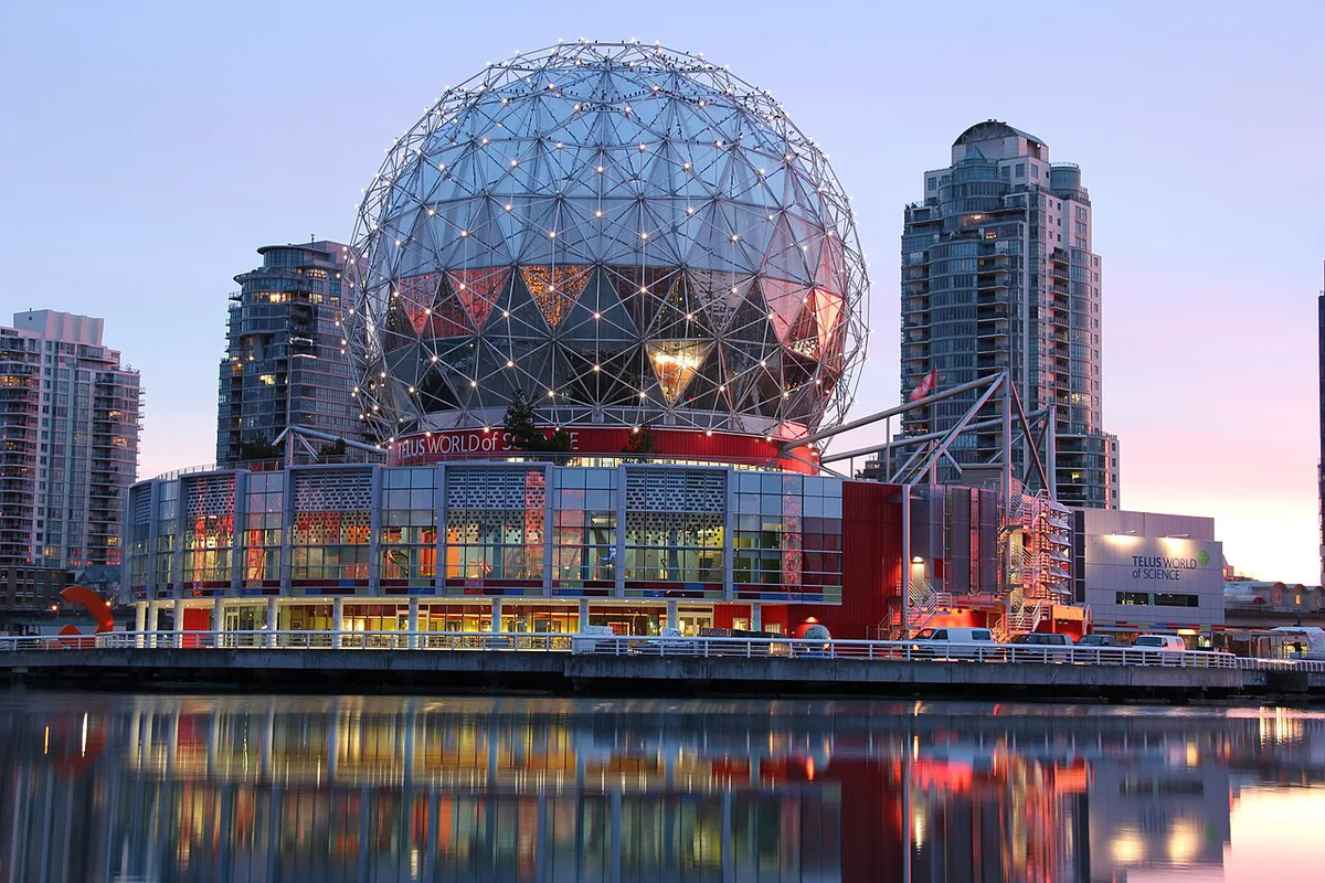 Science World's geodesic dome reflected in False Creek at dusk — 2