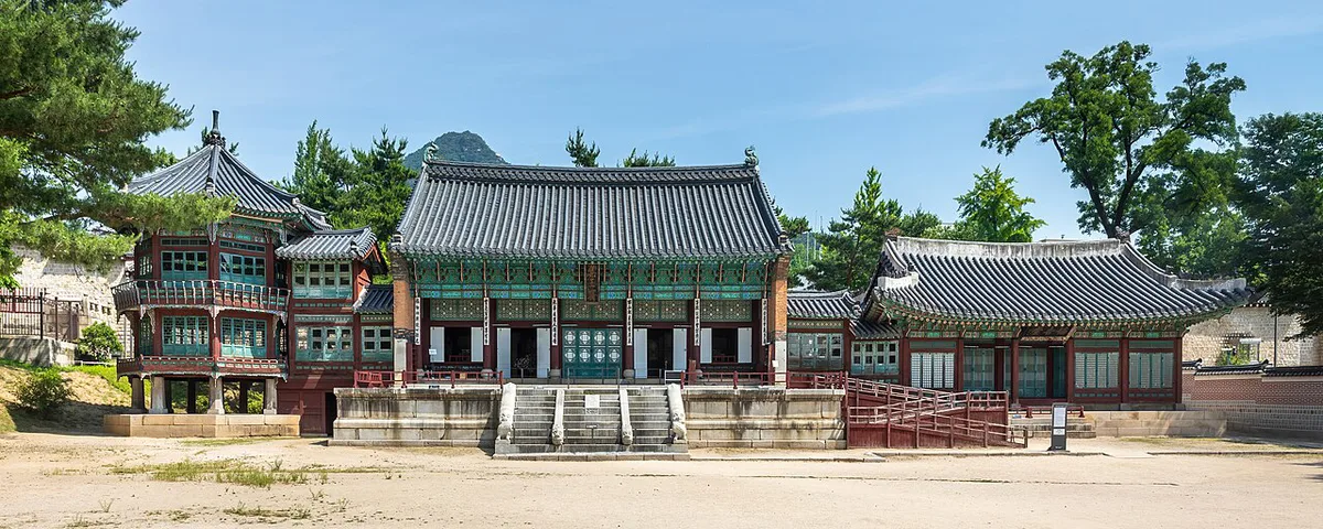 Gyeongbokgung Palace rooftops with N Seoul Tower on Namsan behind — 2