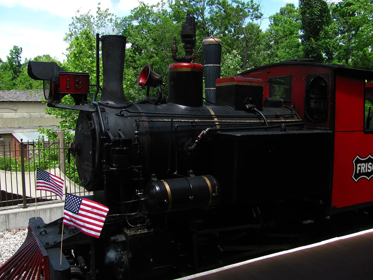 Vintage-style rides and 1880s buildings at Silver Dollar City theme park — 2