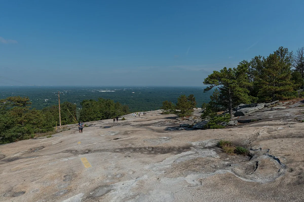 Granite dome of Stone Mountain with the Skyride cable car ascending — 2