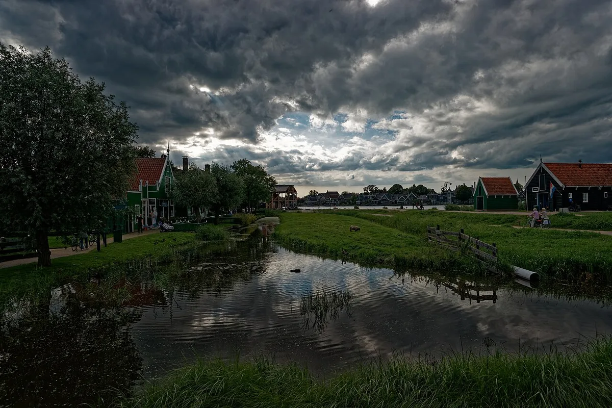 Historic windmills lining the Zaan river at Zaanse Schans — 2